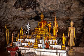 Luang Prabang, Laos - The Pak Ou Caves, the upper cave called Tam Theung. The caves, a Buddhist pilgrimage site, are a repository of old Buddha statues.